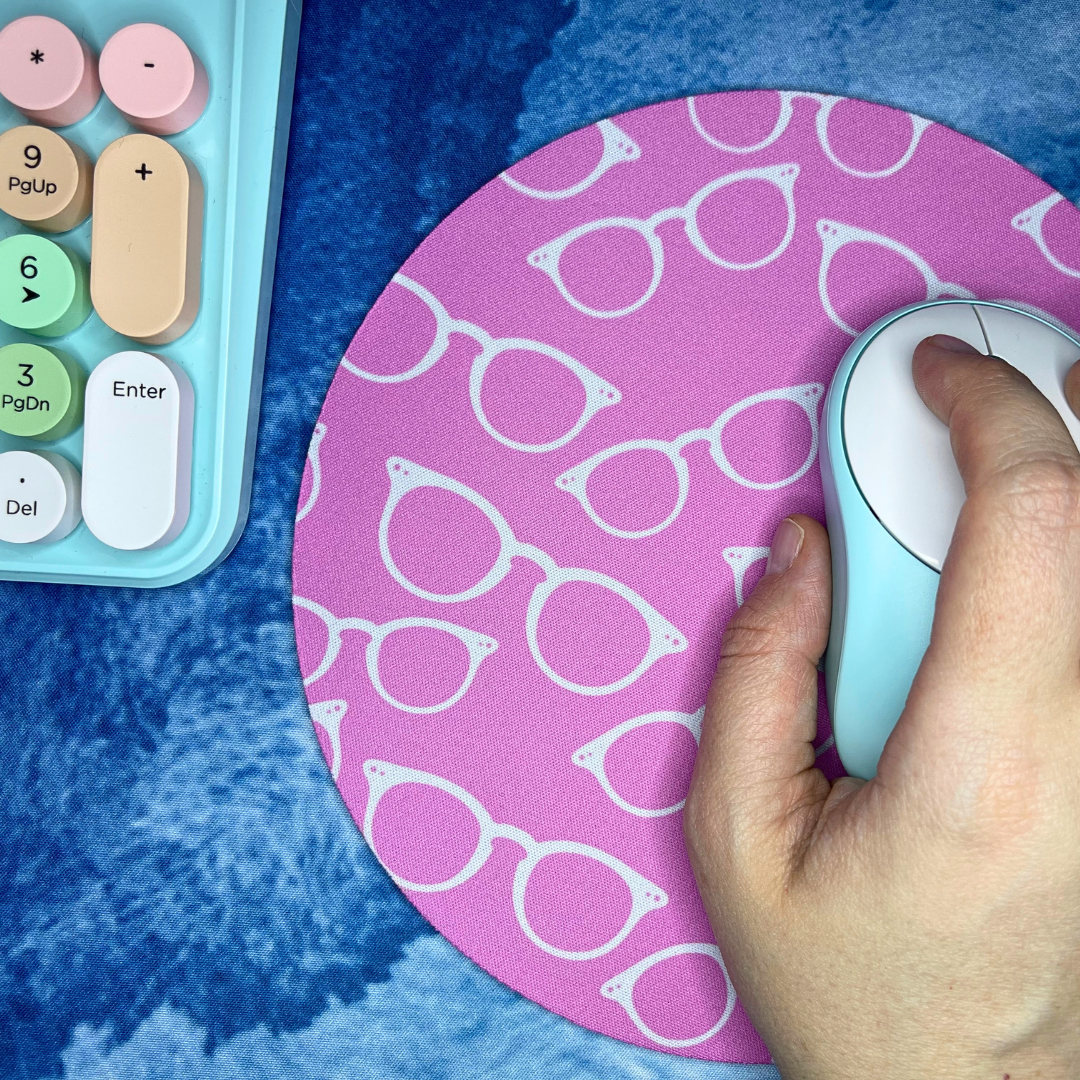 White Glasses on Pink Mousepad